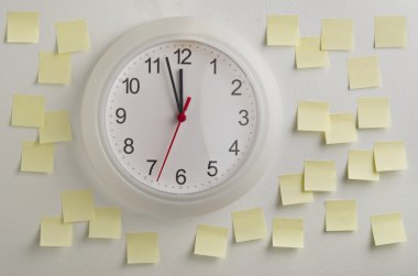 Wall clock surrounded by notes clipart