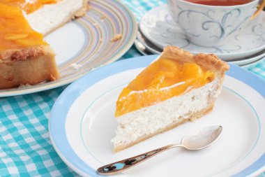 Piece of tasty peach cheesecake with agar jelly on a plate with clipart