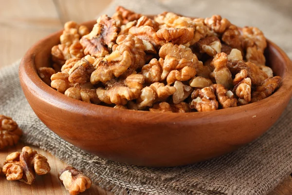 Shelled walnuts on linen fabric background — Stock Photo, Image