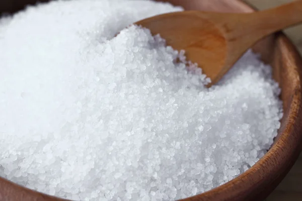 Natural sea salt with seashells in wooden bowl — Stock Photo, Image