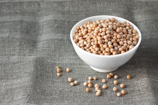 Chickpeas in white ceramic bowl — Stock Photo, Image