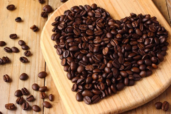 Roasted coffee beans heart. Symbol of love — Stock Photo, Image