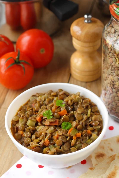 Vegan dinner - green lentils with vegetables — Stock Photo, Image