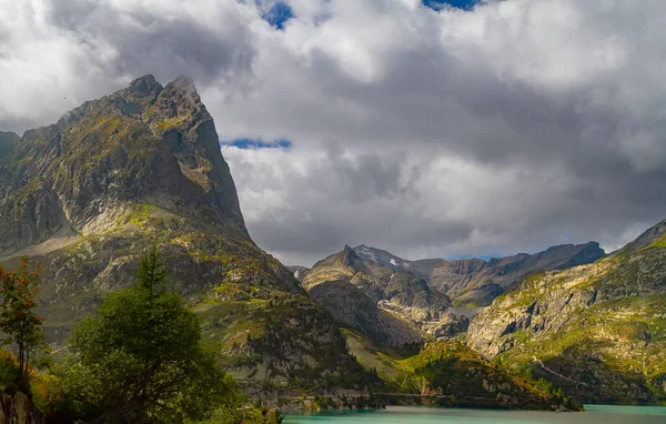 Stunning alpine highlands on sunny days. Scenic image. The majestic rocky mountains in the background. Wild area. Alps. Best travel places. Switzerland