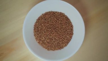 Raw buckwheat in a plate before before cooking