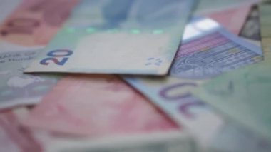 Collection of world money spread out on the table. Close-up