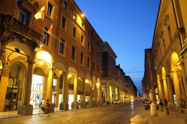 Via Indipendenza avenue at dusk in Bologna Italy