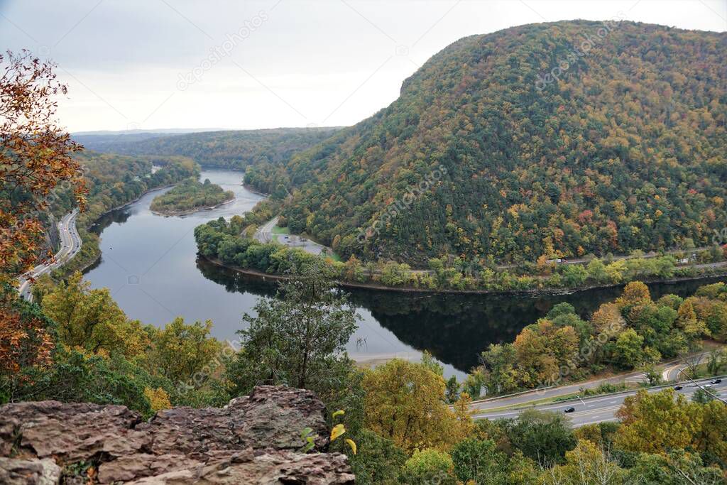 The aerial view of the traffic, Delaware Water Gap and scenery of fall foliage from the top of Mount Tammany Red Dot Trail near Hardwick Township, New Jersey, U.S.A