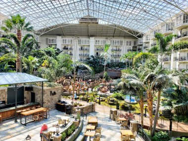 Nashville, Tennessee, U.S.A - June 26, 2022 - The restaurant and tropical plants inside of Gaylord Opryland Resort and Convention Center