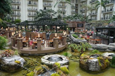 Nashville, Tennessee, U.S.A - June 26, 2022 - The restaurant and beautiful landscape inside of Gaylord Opryland Resort and Convention Center