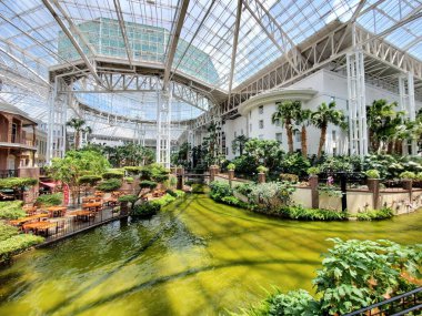 Nashville, Tennessee, U.S - June 26, 2022 - Beautiful river and tropical plants inside of Gaylord Opryland Resort and Convention Center