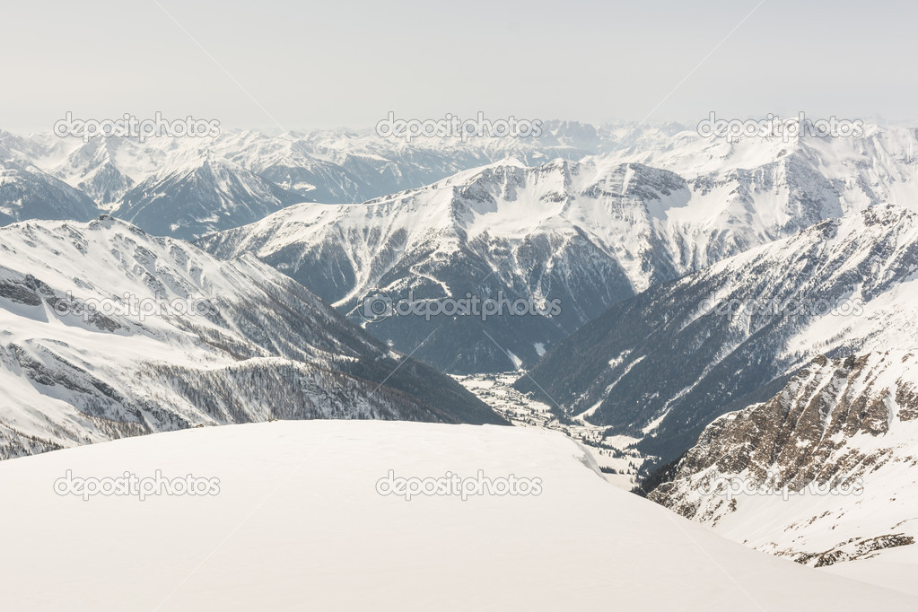 Alpine valley surrounded with mountains