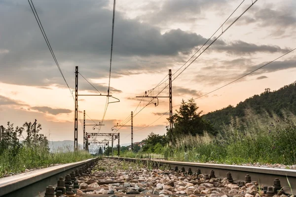 Railroad tracks with a setting sun — Stock Photo, Image