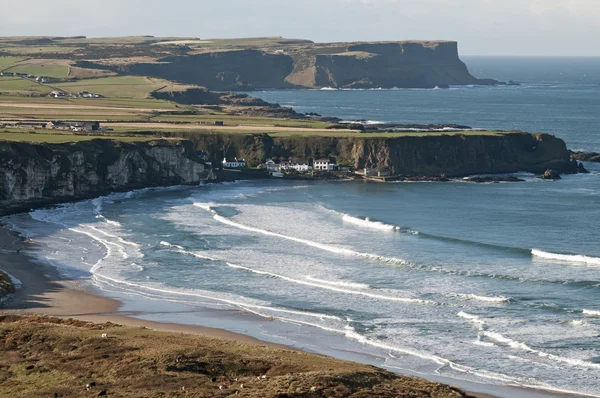 Foggy and sunny coastline with bays