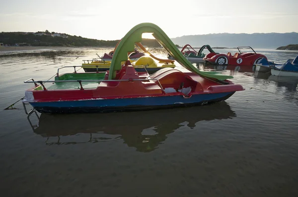 Paddle boats at sunrise — Stock Photo, Image