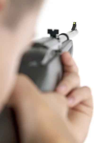 Niño apuntando con pistola de aire vertical —  Fotos de Stock