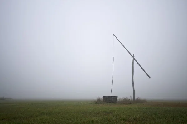 Shadoof in fog — Stock Photo, Image