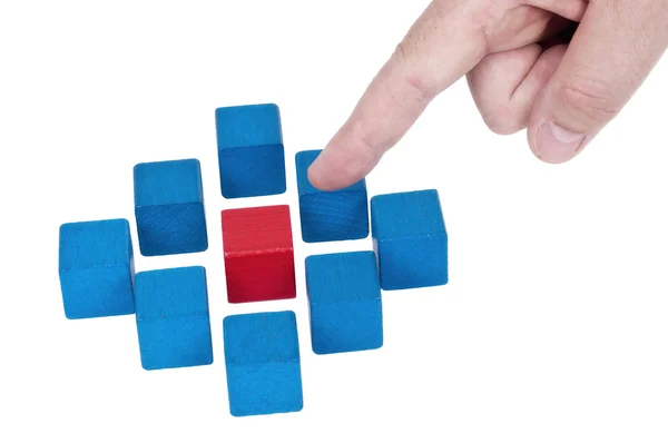 Isolated building blocks with pointing finger — Stock Photo, Image