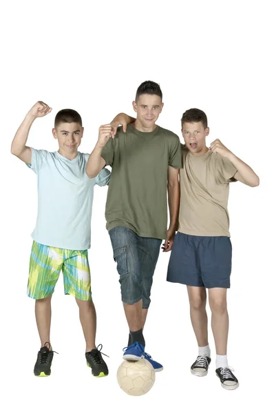 Three young men with ball — Stock Photo, Image