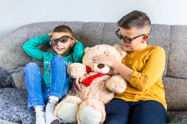 Cute Boys Bothers Watching Movie Glasses Sitting Sofa Living Room — Stock Photo, Image