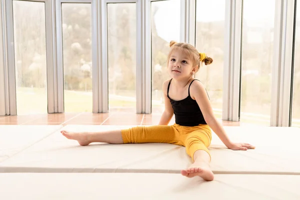 Cute Little Girl Sportswear Sitting Gym Looking Bored — Zdjęcie stockowe