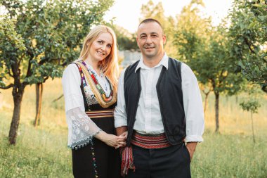 Husband and wife in Serbian traditional clothing.