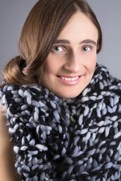 Smiling girl with a scarf