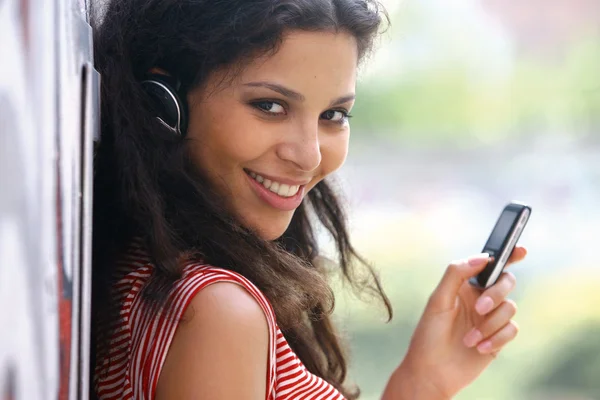 Woman in headphones listen to music tu — Stock Photo, Image