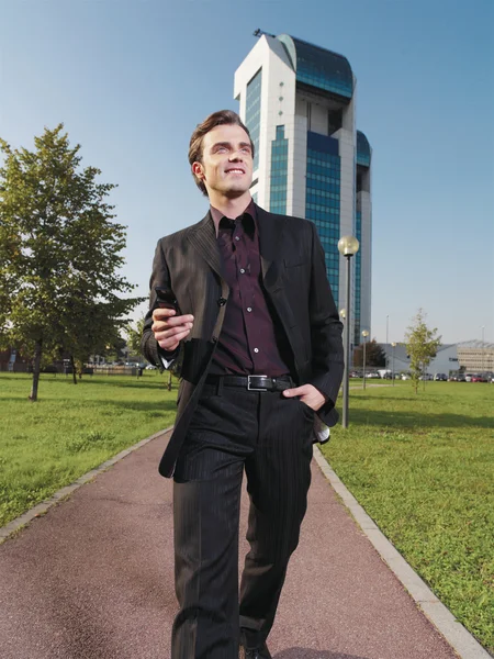 Businessman working near office ad — Stock Photo, Image