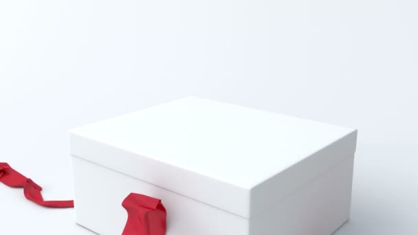 Caja de regalo blanca y baja con apertura de cinta roja — Vídeo de stock