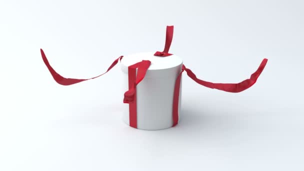 White gift in the shape of a cylinder with red ribbon opening — Stock Video