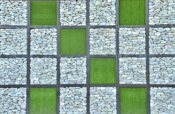 Gräs och sten wall bakgrund — Stockfoto