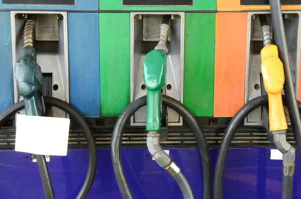 Several gasoline pump nozzles at petrol station — Stock Photo, Image