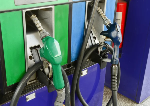 Several gasoline pump nozzles at petrol station — Stock Photo, Image