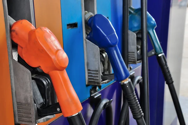 Several gasoline pump nozzles at petrol station, gasoline industry — Stock Photo, Image