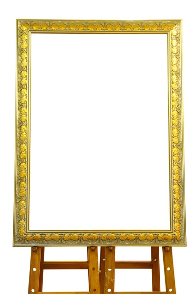 Quadro de imagem de ouro vintage com cavalete de madeira isolado no branco — Fotografia de Stock