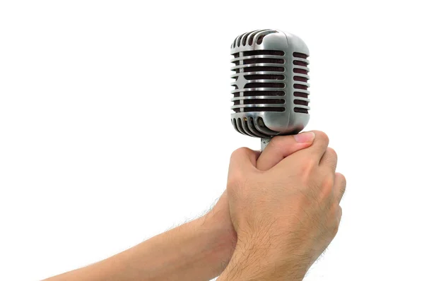 Vintage microphone with hands isolated — Stock Photo, Image