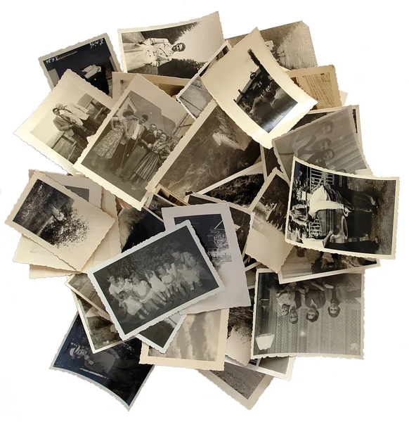 Storia della famiglia: pila di vecchie foto Immagine Stock