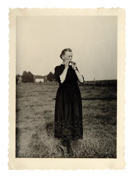 Vintage photo of a woman playing the harmonica — Stock Photo, Image