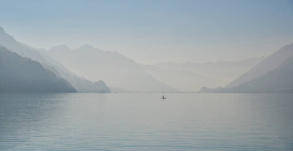 Beautiful landscape around Lake Brienz, Switzerland. The lake is surrounded by a unique landscape of mountains and sparkling waterfalls.