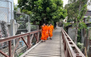 Luang Phrabang, Laos - Feb 5, 2020. Monks walking on street in Luang Phrabang, Laos. The city was the capital of the kingdom of Laos for thousands of years until 1975.