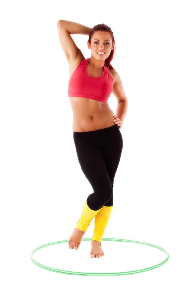 Beautiful healthy woman performs exercises with hula hoops — Stock Photo, Image