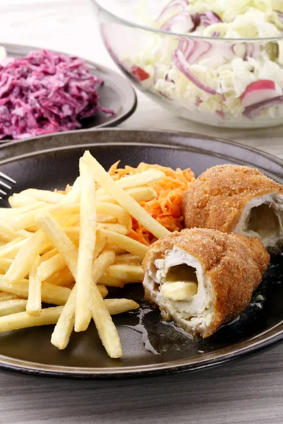 De Volaille chop with french fries and salads — Stock Photo, Image