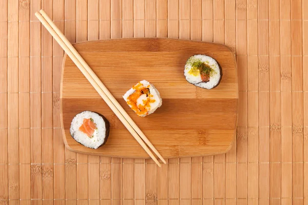 Japan sushi rolls on bamboo — Stock Photo, Image