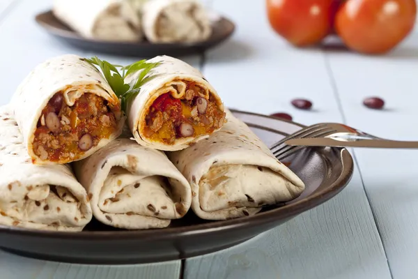 Burritos wraps with meat beans and vegetables — Stock Photo, Image