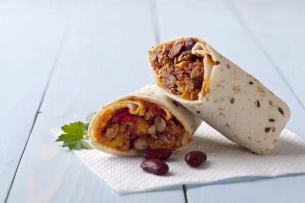 Burritos wraps with meat beans and vegetables — Stock Photo, Image