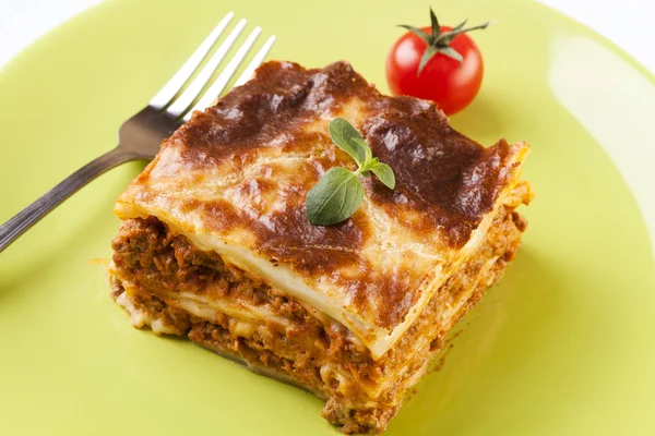 Portion of tasty lasagna on a plate — Stock Photo, Image