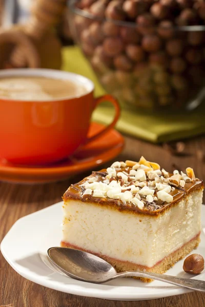 Cheesecake with nuts on plate — Stock Photo, Image