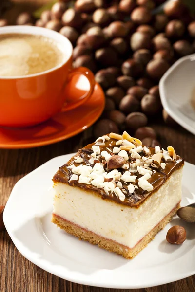 Cheesecake with nuts on plate — Stock Photo, Image
