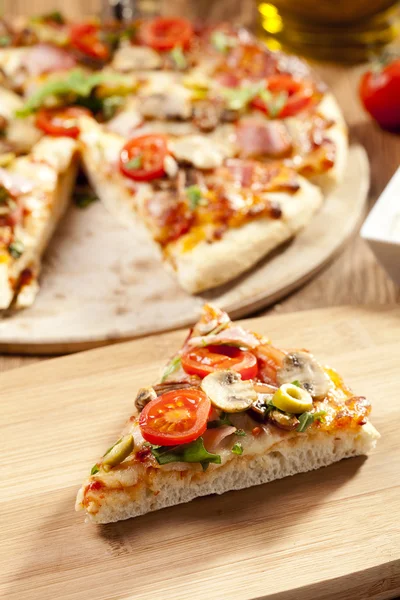 Pizza with ham and mushrooms — Stock Photo, Image